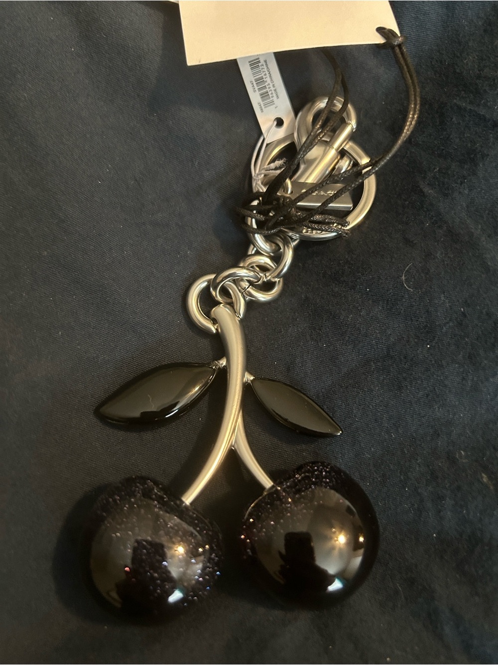 Coach Black Cherry Keychain with Glossy Black Accents